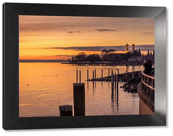 Sunset on the shore of Friedrichshafen with Castle Church, Baden-Wurttemberg, Germany
