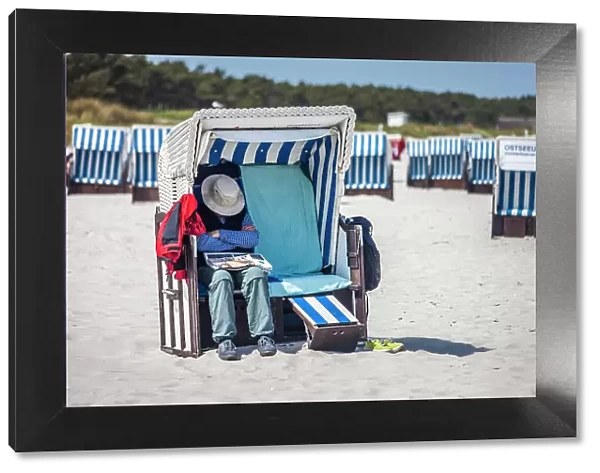 Man sleeping in a beach chair on the beach at Zingst, Mecklenburg-Western Pomerania, Baltic Sea, Northern Germany, Germany