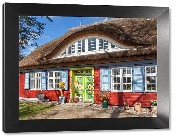Historic beautifully decorated red thatched cottage in Prerow, Mecklenburg-West Pomerania, Baltic Sea, Northern Germany, Germany