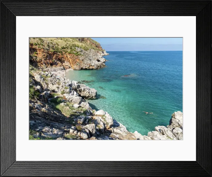 Framed Print : Italy, Sicily, Riserva Naturale Orientata dello Zingaro, Zingaro nature reserve, a man swims in the clear water Framed Print : Italy, Sicily, Riserva Naturale Orientata dello Zingaro, Zingaro nature reserve, a man swims in the clear water