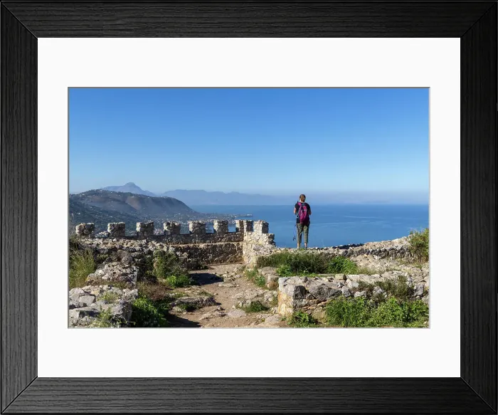 Framed Print : Italy, Sicily, Cefalu, a hiker admires the view of the coastline around Cefalu