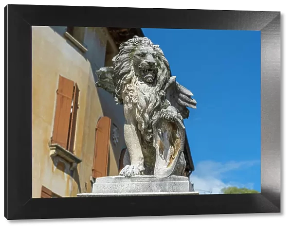 Italy, Veneto. A statue of a lion with wings in the town of Asolo