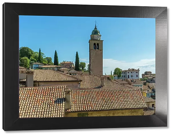 Italy, Veneto. Asolo, view above the roofs towards the tower of the cathedral