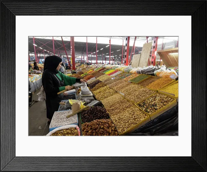 Framed Print : Kyrgyzstan, Bishkek, Osh bazaar, a local woman fills a bag with nuts Framed Print : Kyrgyzstan, Bishkek, Osh bazaar, a local woman fills a bag with nuts