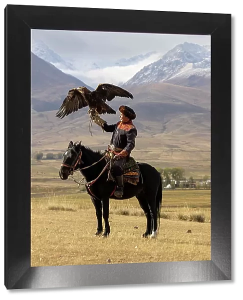 Kyrgyzstan, Issyk Kul Lake, golden eagle hunter on horseback