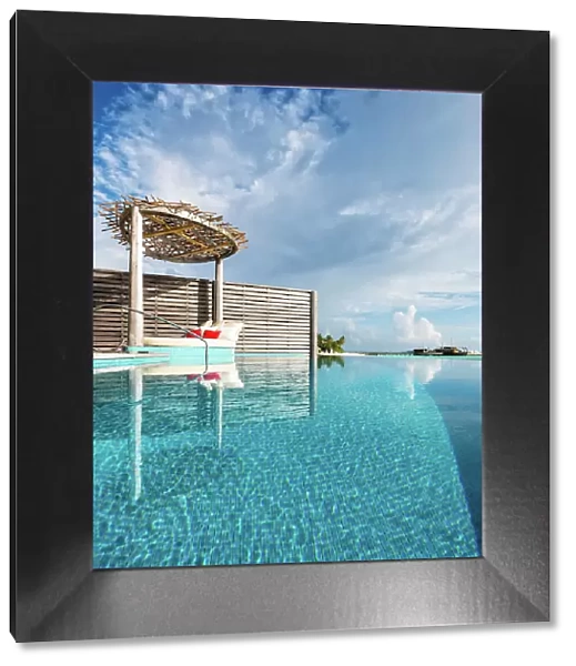 Overwater villa infinity pool reflections, Baa Atoll, Maldives