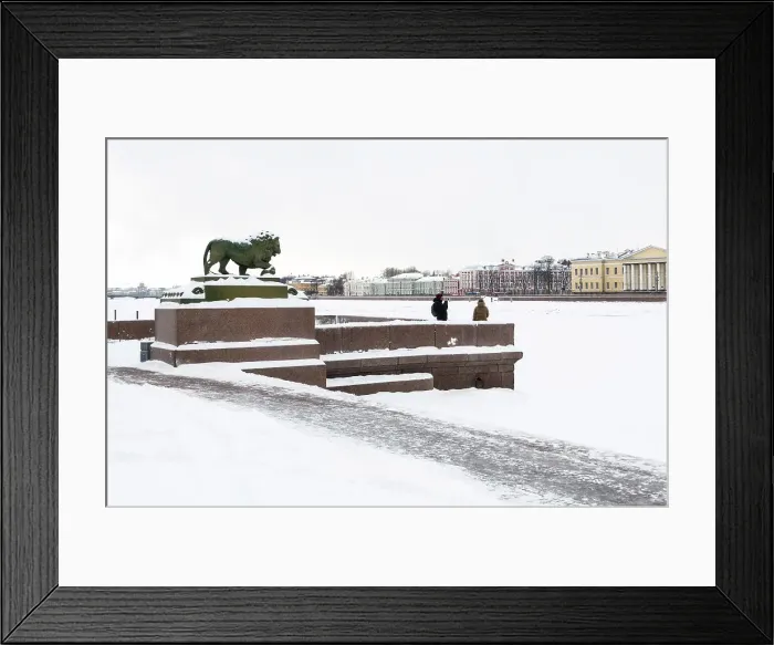 Framed Print : Marble lion at the Dvortsovaya pier of the Admiralty Embankment, on River Neva, looking towards the historic buildings of the University Embankment, Saint Petersburg, Russia