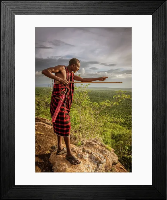 Framed Print : Africa, Tanzania, Manyara Region. Msai man on a rock overlooking the landscape towards the plain of Tarangire National park Framed Print : Africa, Tanzania, Manyara Region. Msai man on a rock overlooking the landscape towards the plain of Tarangire National park