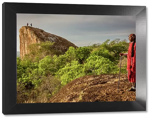 Africa, Tanzania, Manyara Region. Msai men on caracteristic rocks watching the landscape