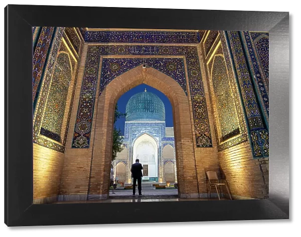 Uzbekistan, Samarkand, Gur-e-Amir mausoleum, resting place of Timur, a man stands at the entrance to the mausoleum
