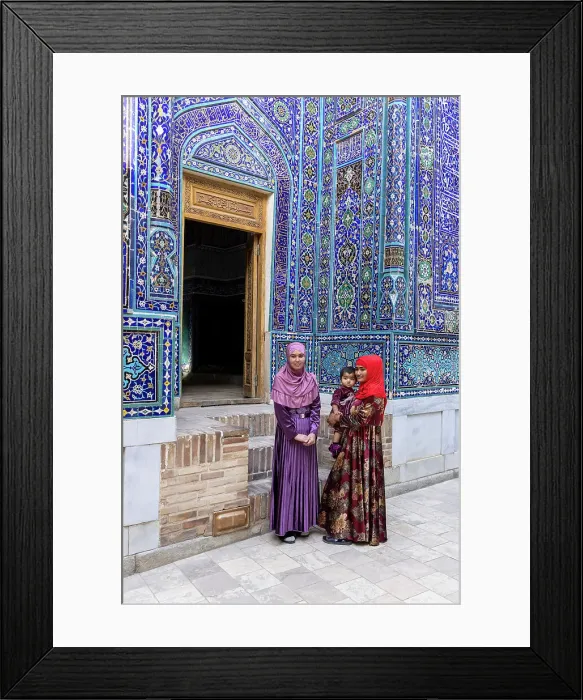Framed Print : Uzbekistan, Samarkand, Shah-i-Zinda, Tomb Street of 11 Mausoleums, two young women with a baby stand in front of the entrance to a mausoleum