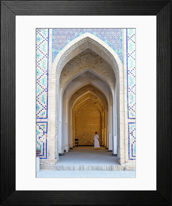 Framed Print : Uzbekistan, Bukhara, Po-i-Kalyan, Kalon Mosque, a tourist walks through an arched walkway