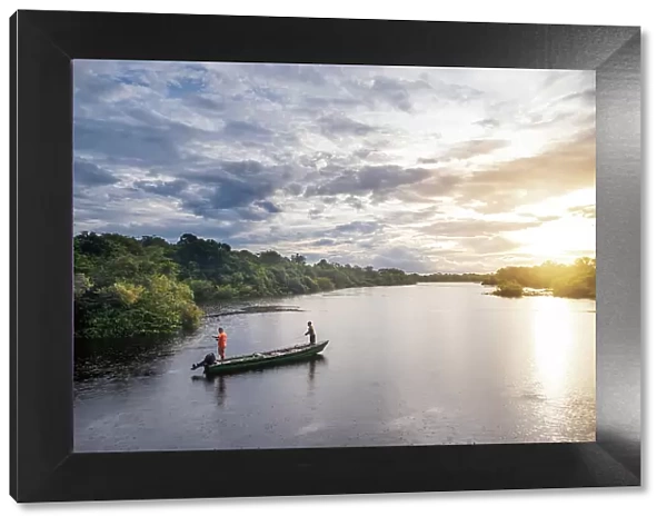 South America, Brazil, Amazon, Amazonas state, Rio Negro, locals fishing from a lauch in the Anavilhanas archipelago
