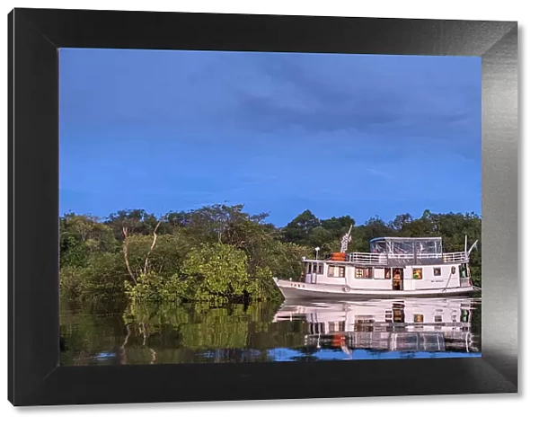 South America, Brazil, Amazon, Amazonas state, Rio Negro, traditional wooden tourist fishing river boat in the Anavilhanas islands