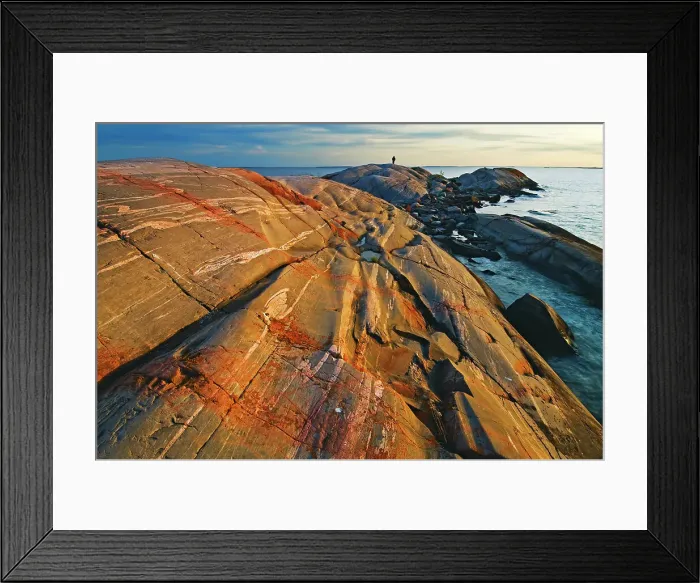 Framed Print : sun setting on rocky island in Georgian Bay with man in the distance South of Philip Edward Island Ontario, Canada Framed Print : sun setting on rocky island in Georgian Bay with man in the distance South of Philip Edward Island Ontario, Canada