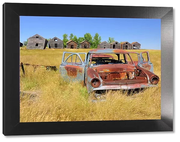 Abandonned car and graneries Rosetown Saskatchewan, Canada