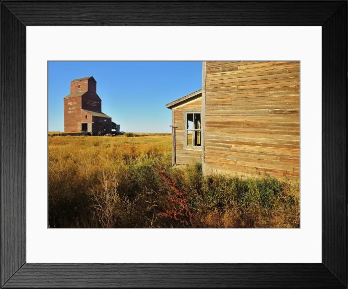 Framed Print : Old general store and grain elevator in ghost town Bents Saskatchewan, Canada