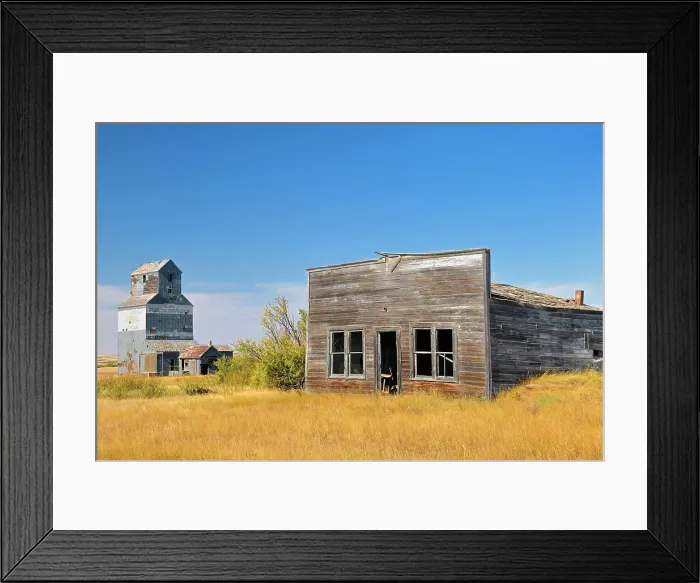 Framed Print : General store and grain elevator in ghost town Fusiller Saskatchewan, Canada Framed Print : General store and grain elevator in ghost town Fusiller Saskatchewan, Canada