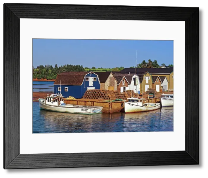 Framed Print : Fishing boats and sheds in coastal village New London, Prince Edward Island, Canada Framed Print : Fishing boats and sheds in coastal village New London, Prince Edward Island, Canada