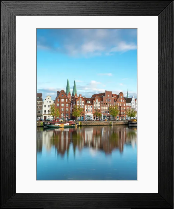 Framed Print : Houses on riverfront of Trave river with towers of St. Marienkirche church in background, Lubeck, UNESCO, Schleswig-Holstein, Germany Framed Print : Houses on riverfront of Trave river with towers of St. Marienkirche church in background, Lubeck, UNESCO, Schleswig-Holstein, Germany