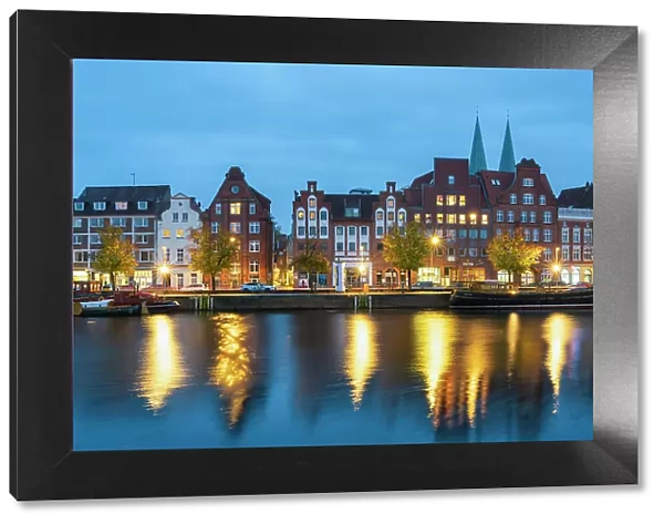 Houses with traditional gables along Trave river at twilight, Lubeck, UNESCO, Schleswig-Holstein, Germany