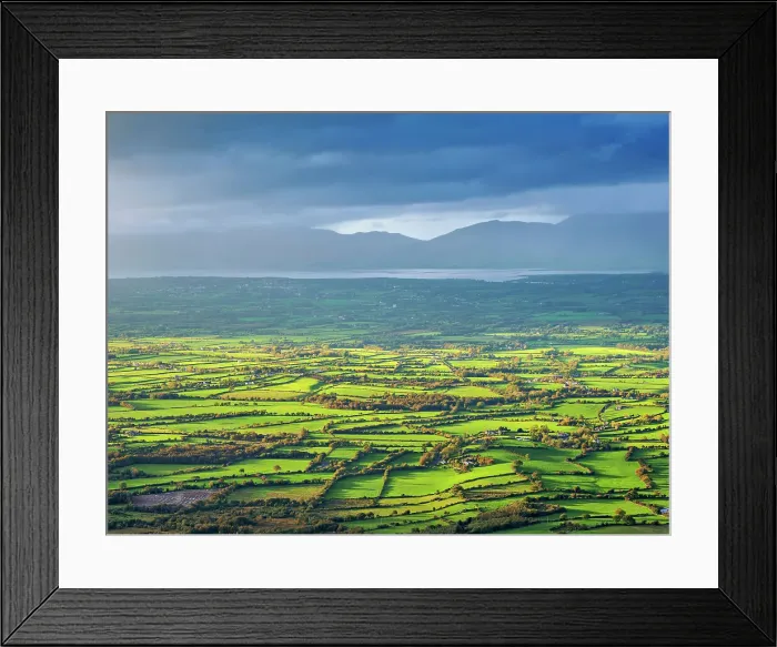 Framed Print : View over the green fields towards the Atlantic Coast from the top of the Strickeen Mountain, Ballagh, County Kerry, Ireland Framed Print : View over the green fields towards the Atlantic Coast from the top of the Strickeen Mountain, Ballagh, County Kerry, Ireland