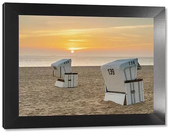 Beach chairs at Hornum beach at sunrise, Sylt, Nordfriesland, Schleswig-Holstein, Germany