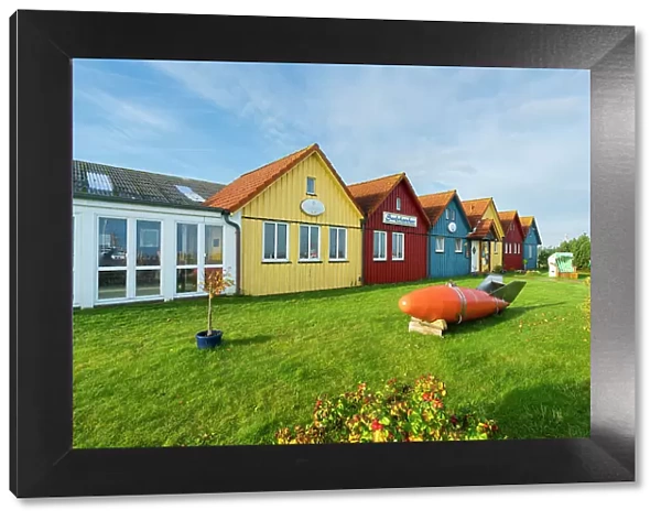 Colorful houses of Seefohrerhus restaurant, Wittdun harbor, Amrum island, Nordfriesland, Schleswig-Holstein, Germany