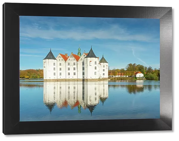 Glucksburg castle with reflection on Schlossteich, Glucksburg, Schleswig-Flensburg, Schleswig-Holstein, Germany