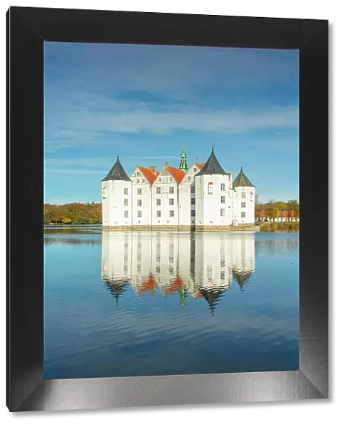 Glucksburg castle with reflection on Schlossteich, Glucksburg, Schleswig-Flensburg, Schleswig-Holstein, Germany