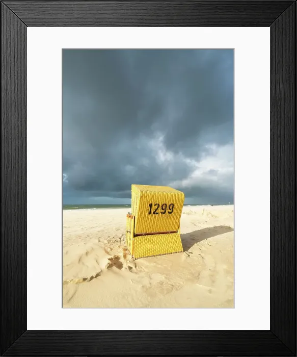 Framed Print : Beach chair against cloudy dramatic sky, Wenningstedt beach, Sylt, Nordfriesland, Schleswig-Holstein, Germany Framed Print : Beach chair against cloudy dramatic sky, Wenningstedt beach, Sylt, Nordfriesland, Schleswig-Holstein, Germany