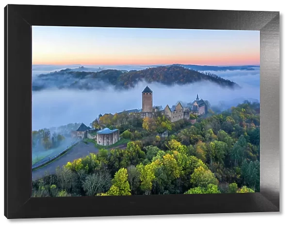 Aerail view at Lichtenberg castle in morning fog, Thallichtenberg, Rhineland-Palatinate, Germany