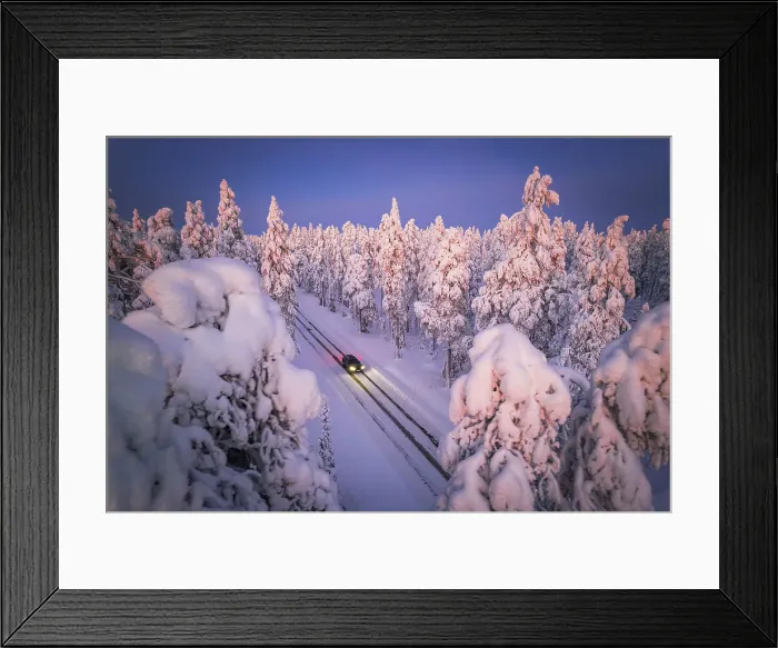 Framed Print : Drone a car with headlight on travelling the icy slippery road crossing the forest covered with snow, Muonio, Lapland, Finland Framed Print : Drone a car with headlight on travelling the icy slippery road crossing the forest covered with snow, Muonio, Lapland, Finland