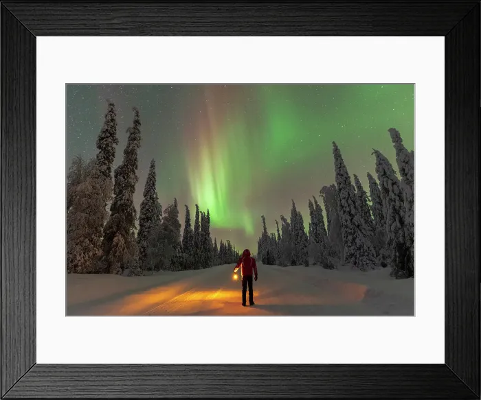 Framed Print : Man with lantern standing in the middle of an icy road looking at Northern Lights (Aurora Borealis), Pallas-yllastunturi national park, Lapland, Finland (MR) Framed Print : Man with lantern standing in the middle of an icy road looking at Northern Lights (Aurora Borealis), Pallas-yllastunturi national park, Lapland, Finland (MR)