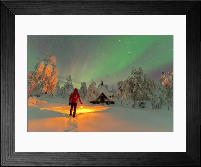 Framed Print : Rear a man with lantern admiring northern lights (aurora borealis) from a finnish hut (kota) in the icy forest, Lapland, Finland (MR) Framed Print : Rear a man with lantern admiring northern lights (aurora borealis) from a finnish hut (kota) in the icy forest, Lapland, Finland (MR)