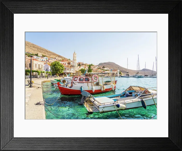 Framed Print : The colourful harbour and Saint Nicholas church in the background, Halki, Chalki, Dodecanese Islands, Greece Framed Print : The colourful harbour and Saint Nicholas church in the background, Halki, Chalki, Dodecanese Islands, Greece