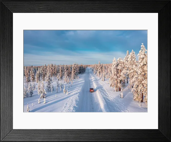 Framed Print : High angle car driving on an icy road among trees covered with snow, Kangos, Lapland, Sweden Framed Print : High angle car driving on an icy road among trees covered with snow, Kangos, Lapland, Sweden
