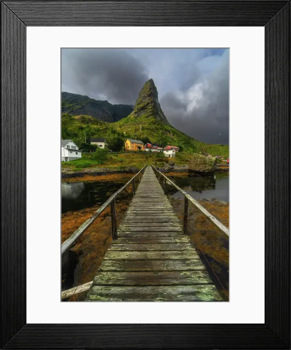 Framed Print : A small wooden bridge creates a great leading line towards the rugged peak and the colorful houses in Reine. Lofoten Islands, Norway Framed Print : A small wooden bridge creates a great leading line towards the rugged peak and the colorful houses in Reine. Lofoten Islands, Norway