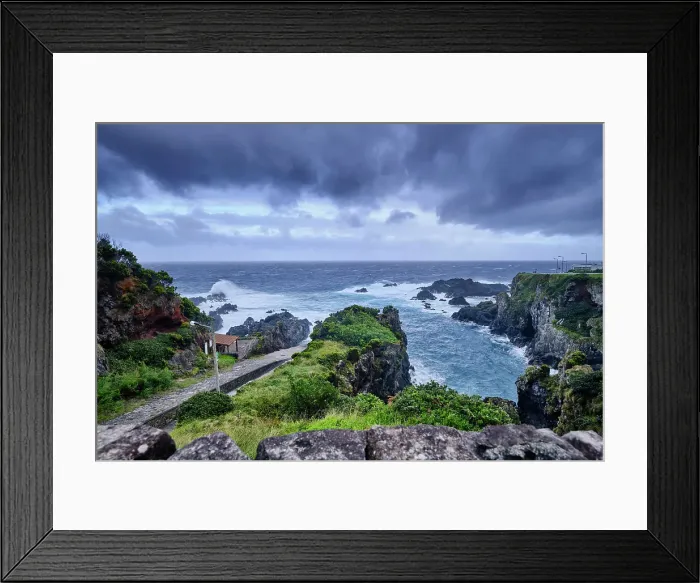 Framed Print : The northeast coast of Flores island, at Boqueirao, on a stormy day. The ramp to pull the sperm whales on the left, by the sea. Azores islands, Portugal Framed Print : The northeast coast of Flores island, at Boqueirao, on a stormy day. The ramp to pull the sperm whales on the left, by the sea. Azores islands, Portugal