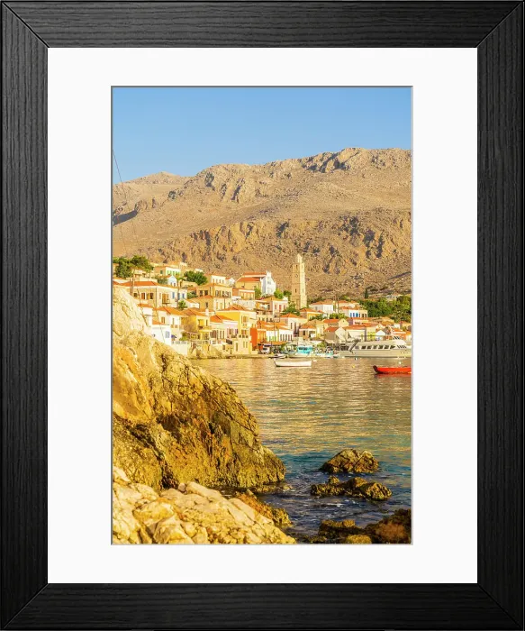 Framed Print : The colourful harbour and Saint Nicholas church in the background, Halki, Chalki, Dodecanese Islands, Greece Framed Print : The colourful harbour and Saint Nicholas church in the background, Halki, Chalki, Dodecanese Islands, Greece