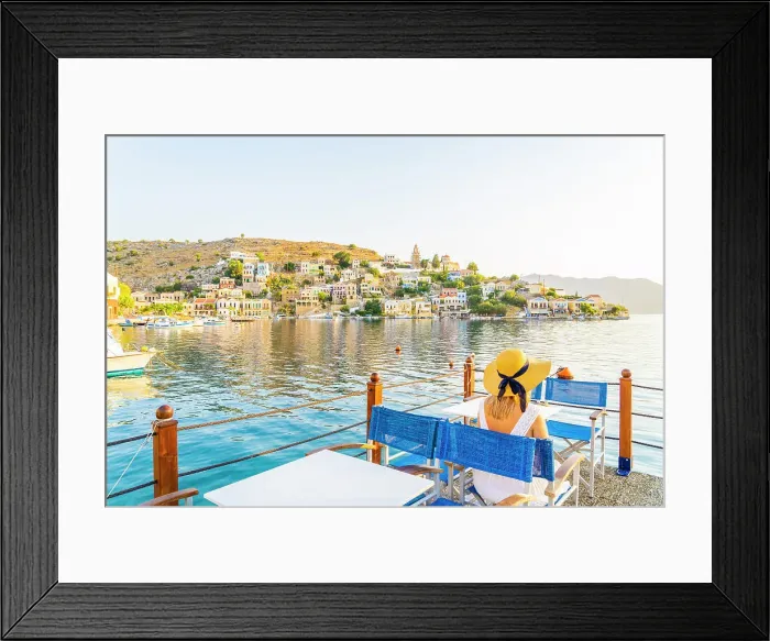 Framed Print : A woman in a hat by the colourful harbour in Symi, Dodecanese Islands, Greece. (MR) Framed Print : A woman in a hat by the colourful harbour in Symi, Dodecanese Islands, Greece. (MR)