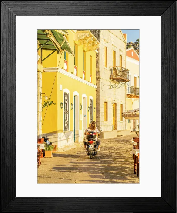 Framed Print : A couple riding a scooter in Symi, Dodecanese Islands, Greece Framed Print : A couple riding a scooter in Symi, Dodecanese Islands, Greece