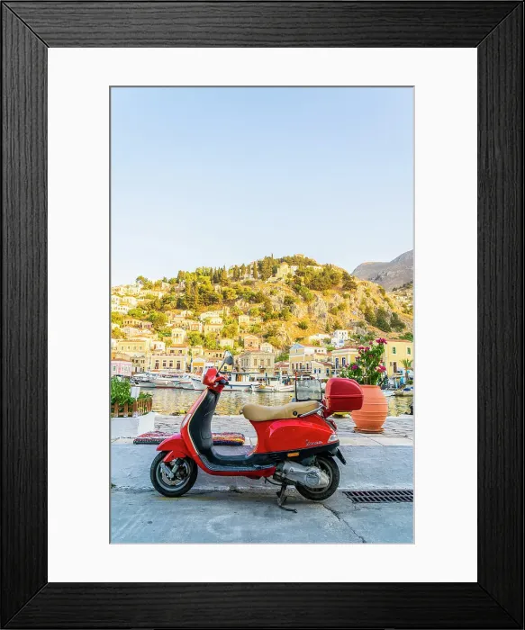 Framed Print : A vespa scooter by the colourful harbour in Symi, Dodecanese Islands, Greece Framed Print : A vespa scooter by the colourful harbour in Symi, Dodecanese Islands, Greece