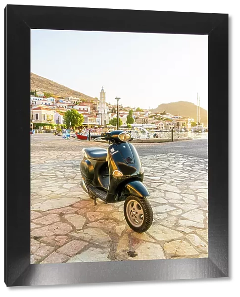 A Vespa motor cycle by the Harbour in Halki, Dodecanese Islands, Greece