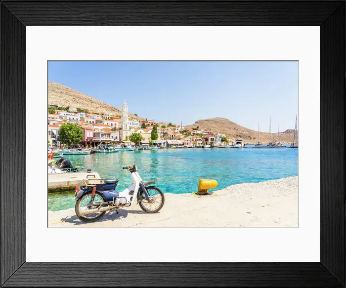 Framed Print : Motor cycle by the harbour and St Nicholas Church, Halki, Dodecanese Islands, Greece Framed Print : Motor cycle by the harbour and St Nicholas Church, Halki, Dodecanese Islands, Greece