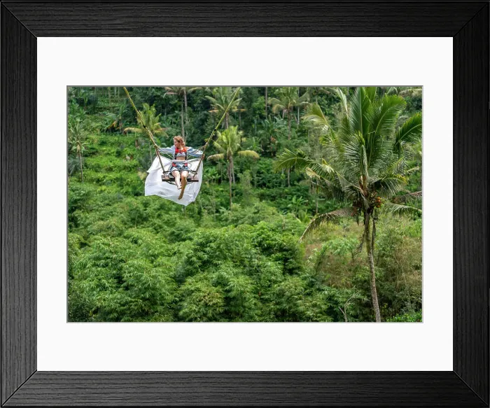 Framed Print : Tourist woman swinging over the Balinese tropical forest, Ubud, Indonesia Framed Print : Tourist woman swinging over the Balinese tropical forest, Ubud, Indonesia