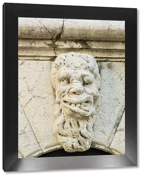 Carving of a face, Castello, Venice, Veneto, Italy