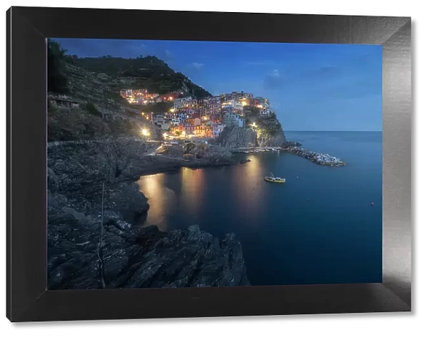 Blue hour over the small fishermen's town of Manarola, part of Cinque Terre in Liguria, in spring. Cinque Terre, Italy