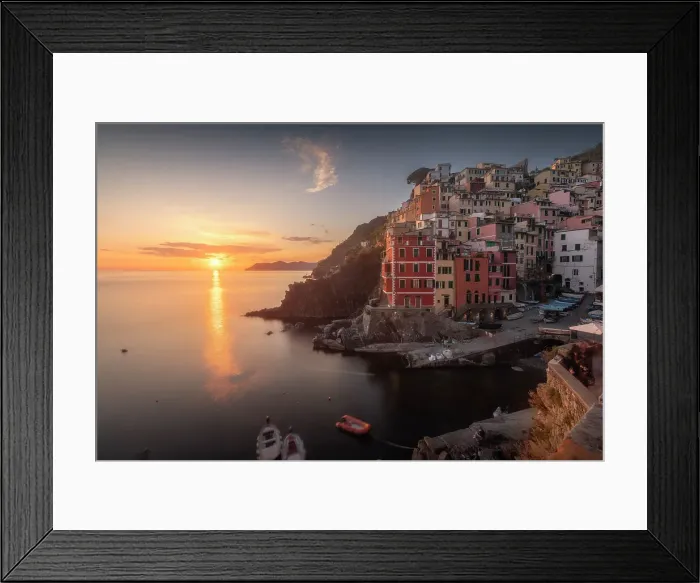 Framed Print : A clear sky over the town of Riomaggiore, part of the Cinque Terre in Italy, during a spring sunset. Cinque Terre, Italy Framed Print : A clear sky over the town of Riomaggiore, part of the Cinque Terre in Italy, during a spring sunset. Cinque Terre, Italy