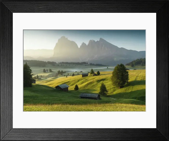 Framed Print : Meadows of the Alpe di Siusi (Seiser Alm), with the Sassolungo and Sassopiatto wooden cabins. Dolomites, Italy Framed Print : Meadows of the Alpe di Siusi (Seiser Alm), with the Sassolungo and Sassopiatto wooden cabins. Dolomites, Italy